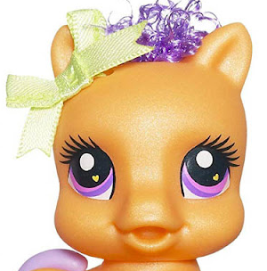 A my little pony toy of a baby horse is staring directly into your soul with its front-facing, predator eyes.